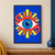 One oversized stylized blue eye with turquoise radial spokes and a white catchlight, framed by curling coral-red forms and yellow-orange rays on a blue field.; frame shown for styling only