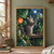 Seated grey tabby reaching toward a suspended glass terrarium with a fern, surrounded by greenhouse foliage, pots, and an orange flower.; frame shown for styling only
