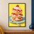 Tall strawberry shortcake with pink cream and strawberry slices on a pale aqua plate, with a fork and crumbs against a yellow background.; frame shown for styling only