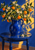 Cobalt-blue pitcher filled with orange-bearing branches and white blossoms on a round blue table in golden light.