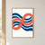 A broad coral figure-eight loop crosses navy and pale-aqua horizontal wave bands against an off-white background.; frame shown for styling only