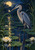 A blue-gray heron stands among lily pads, reeds, and white water lilies, with a glowing moth near its bill and a full moon at upper left.