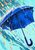 Cobalt umbrella with a hooked handle amid turquoise water streaks, white splashes, and coral and yellow drops.