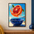 Cut blood-orange half floating above a deep cobalt bowl, surrounded by an arcing juice splash, droplets, and green leaves with sea and coast behind.; frame shown for styling only