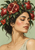 Closed-eyed woman framed by dense pomegranate foliage and whole fruits, with a large split ruby-seeded fruit above her brow on a sage background.