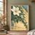 White clematis-like flowers, buds, and deep green leaves climbing diagonally across a golden limestone wall.; frame shown for styling only