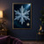 Large blue-white six-branched crystalline snowflake with a smaller amber crystal, moon and diagonal light rays in a deep blue-green night sky.; frame shown for styling only