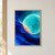 Large glowing turquoise circle crossed by a deep blue sweeping band, with a coral crescent and faint surrounding rings.; frame shown for styling only