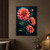 Three vivid coral, pink, red and orange dahlias with a closed bud and dark branching foliage against a midnight teal background.; frame shown for styling only