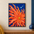 Large orange-coral radial form with a small golden center and three pale aqua bubbles on a deep blue background.; frame shown for styling only