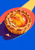 Golden fluted peach tart with glossy peach sections and almond slivers, crossed by a diagonal sunbeam against cobalt blue.