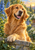 Friendly golden retriever leaning one forepaw over a stone garden wall, with blue delphinium flowers and a sunlit leafy garden behind.