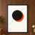 Black disk overlapping a vermilion circle with a thin cobalt arc and three small dots on an ivory background.; frame shown for styling only