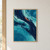 Intersecting indigo and turquoise abstract currents with a coral streak on a textured portrait composition.; frame shown for styling only