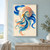 Patterned nautilus shell with an exposed spiral chamber surrounded by broad blue, turquoise, and coral wave-like ribbons on a pale background.; frame shown for styling only