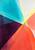 Abstract turquoise, coral, plum, lemon, and white color planes converging at a bright central point.