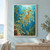 Leafy seadragon with leaf-like appendages swimming upward through turquoise water among kelp and bubbles.; frame shown for styling only