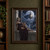 Pale-haired pointed-eared woman in a plum gown seated on a carved parapet before a moonlit city and gothic towers.; frame shown for styling only