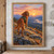 Red-gold, long-eared dog in a green field vest and orange neckerchief looking back from rocky ground above a valley.; frame shown for styling only