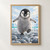 A fluffy penguin chick balances with one foot raised and wings outstretched on a field of icy pebbles.; frame shown for styling only