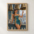 Horned woman in a teal-and-gold dress points toward a decorated bell on a stone balcony overlooking a mountain city and water.; frame shown for styling only