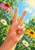 Warm-toned hand making a peace sign among pink coneflowers, white daisies, blue blossoms, and green foliage beneath a bright blue sky.