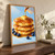 Three golden pancakes topped with melting butter and amber syrup, with blueberries around the base and syrup pouring from a cropped pitcher.; frame shown for styling only