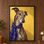 Chest-up portrait of a brindle greyhound wearing a blue scarf with orange-red abstract shapes against a warm yellow wall.; frame shown for styling only