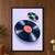 Two dark vinyl records with blank coral and teal center labels float over lavender, linked by a curved mint-and-gold trail.; frame shown for styling only