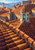 Terracotta rooftops and a turquoise-glazed stone cupola overlook distant blue water and mountains.