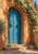 Weathered blue double doors with iron studs and ring handles beneath a terracotta arch, framed by white flowering vines and stone steps.