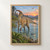 A crested ochre-brown Parasaurolophus wading in a blue-green river, with ferns, distant hills, and flying reptiles beneath a sunset sky.; frame shown for styling only