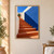 Terracotta staircase rising between pale plaster walls toward a potted agave, beside a broad cobalt-blue wall and shadow.; frame shown for styling only