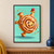 Smiling iced cinnamon-roll character tilted in a tumble, balancing a raspberry on one hand with cinnamon crumbs on a mint-teal background.; frame shown for styling only