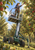 Worker in a safety harness reaching for a red apple from an elevated wheeled orchard platform among apple trees.