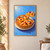 A golden peach tart topped with peach slices, raspberries, and edible flowers, with one slice lifted on a server against blue.; frame shown for styling only