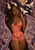 Horned, pointed-eared woman with long braids framed by large purple patterned wings and pale moths.