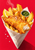 Golden battered fish and thick-cut chips in a pale paper cone with lemon, green sauce, salt, and steam on a red background.