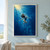 Adult swimmer with long flowing hair floating underwater in a dark blue garment, arms extended and knees bent, surrounded by bubbles and refracted blue light.; frame shown for styling only