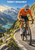 Orange-clad cyclist climbs a winding alpine road above a turquoise lake, with smaller riders below and SUMMIT BREAKAWAY lettering at the top.