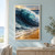 Large indigo wave curling toward an ochre beach, with turquoise and white foam under a pale sky.; frame shown for styling only