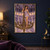 A horned woman in a lavender dress stands on an ornate chandelier in a symmetrical ballroom with curved balconies.; frame shown for styling only