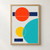 Abstract geometric poster with overlapping vermilion, navy, turquoise, and yellow circles and bars on light gray.; frame shown for styling only