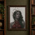 Pointed-ear woman with long dark hair wearing a tall web-like crown and red web-patterned bodice.; frame shown for styling only