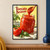Glass jar of red tomato sauce with a wooden spoon lifting a ribbon of sauce, tomato and basil in a bright kitchen; Tomato Season title at upper left.; frame shown for styling only