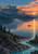 Sunrise above a caldera-like mountain and lake, with a small skiff and paddler on the water and a turquoise river in the rocky foreground.