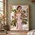 Model in a pale pink dress with green leafy sprigs and rounded topiary forms in a pale-stone courtyard.; frame shown for styling only