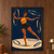Barefoot woman in a gold top and dark skirt balancing among gold-edged hoops on a textured navy background.; frame shown for styling only