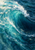 Large turquoise-blue ocean wave curling around a dark trough, with a bright white foamy crest and scattered reflections.