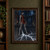 Gray-skinned, pointed-eared woman in rust-red armor holds a sword as branching white energy crosses a dark stone hall.; frame shown for styling only